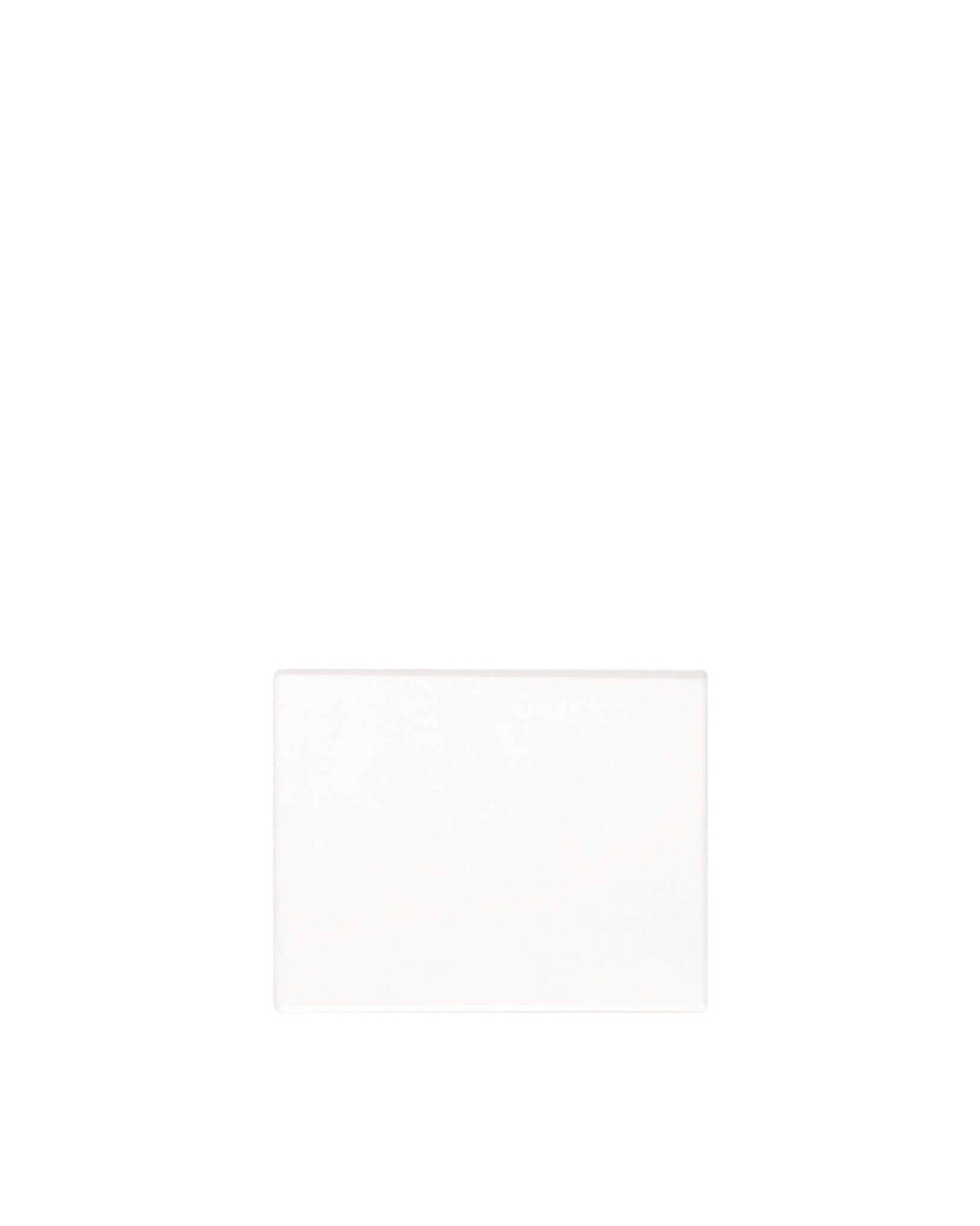 White rectangular spare part by Alessi with a smooth, matte finish and subtle rounded edges.