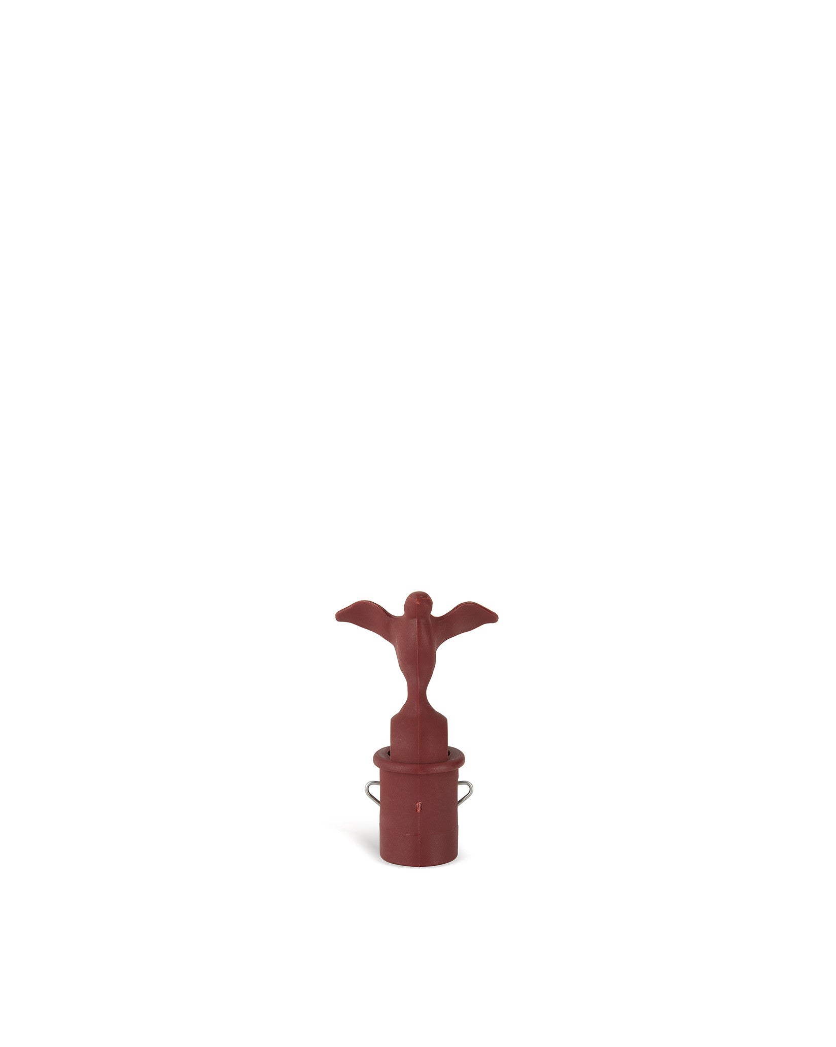 A reddish-brown bottle stopper with a bird figure by Alessi, featuring a cylindrical base with two metal loops.