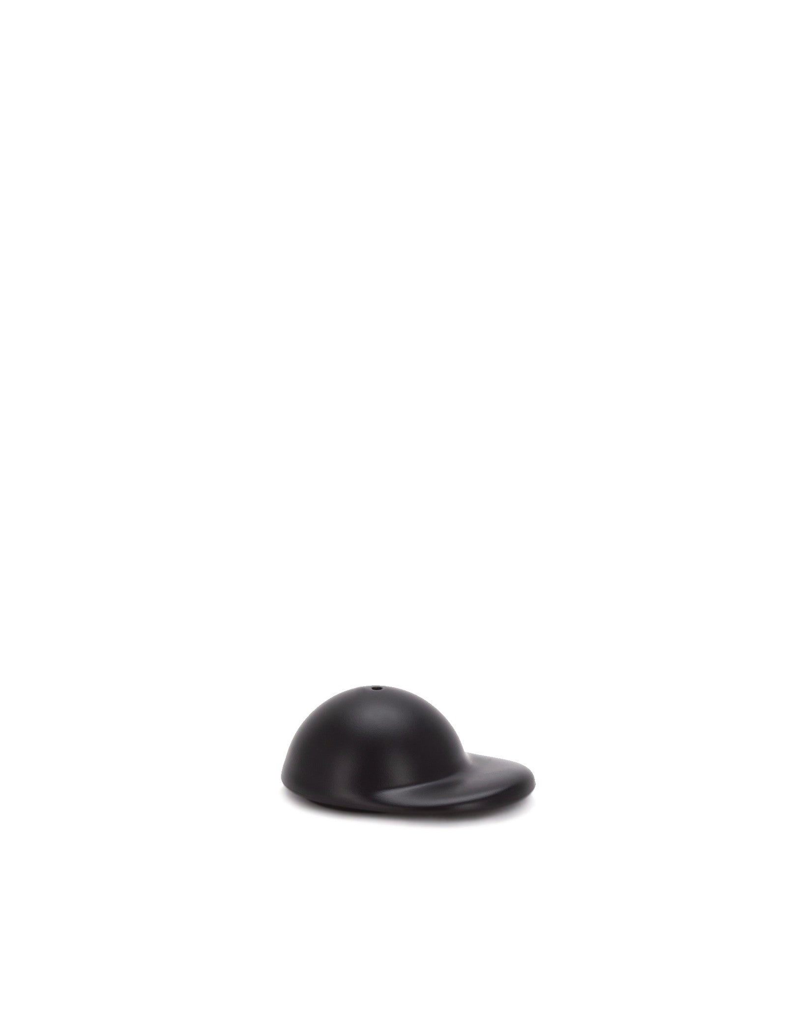 Black cap-shaped spare part by Alessi, with a matte finish and a small hole on top.