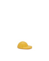 Yellow hat-shaped spare part by Alessi, smooth and domed with a flat front brim.