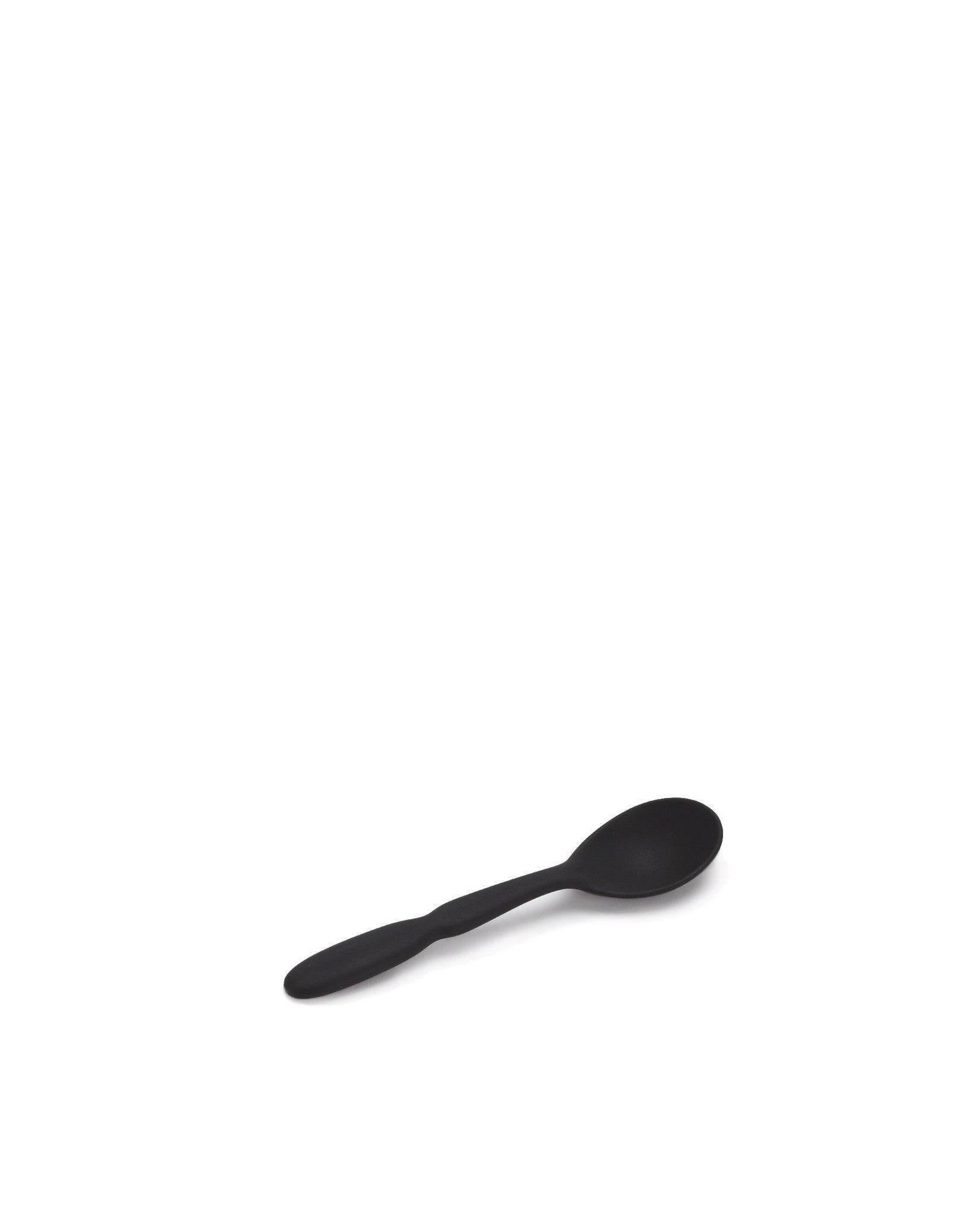 Black matte spoon by Alessi, lying angled on a white surface.