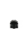 Black cylindrical brush head by Alessi with dense, flexible bristles on a white background.
